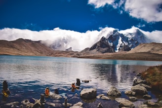 a body of water surrounded by mountains and rocks