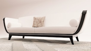 a white couch sitting on top of a rug
