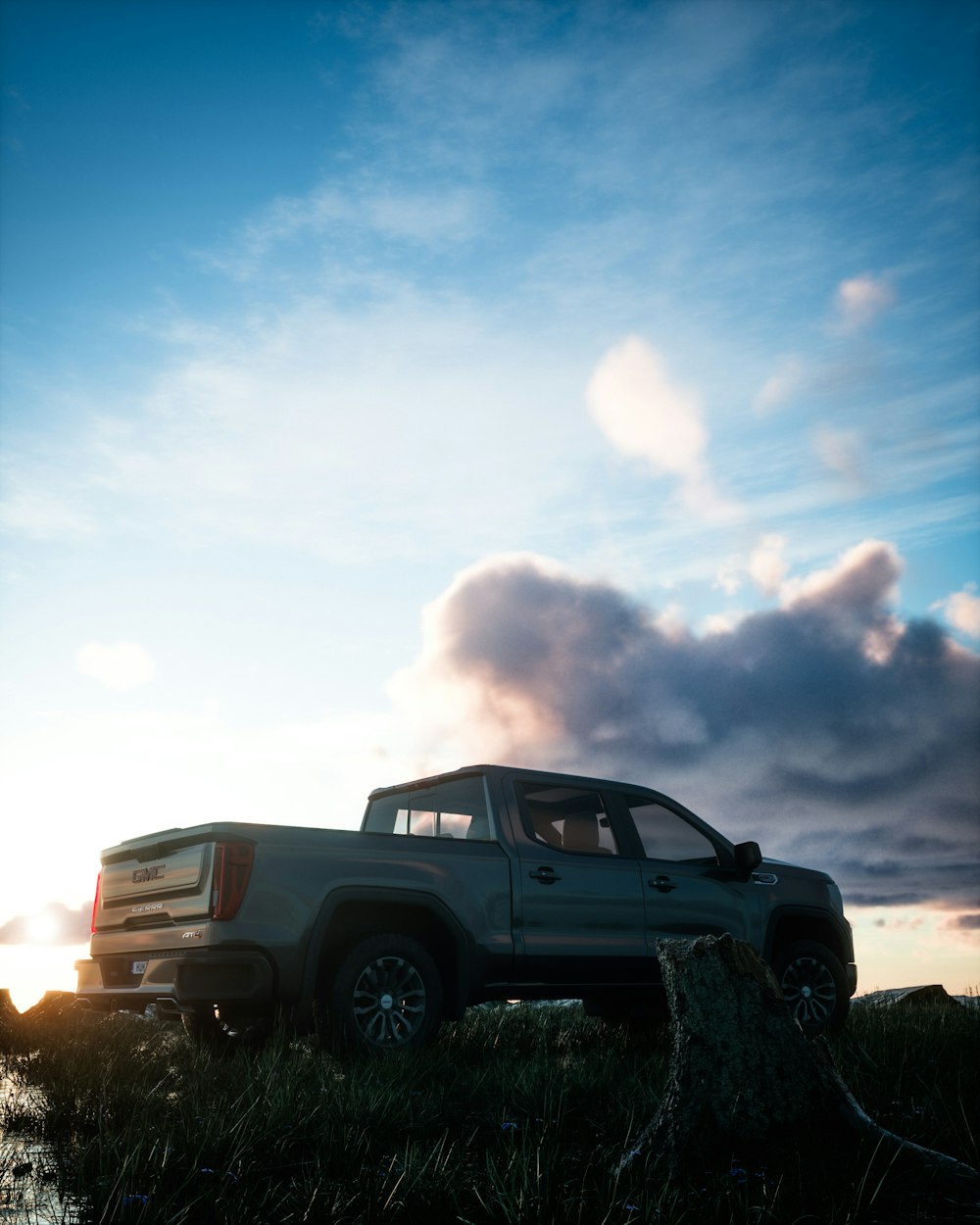 a pick up truck parked in a grassy field