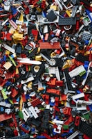 a pile of assorted legos sitting on top of each other