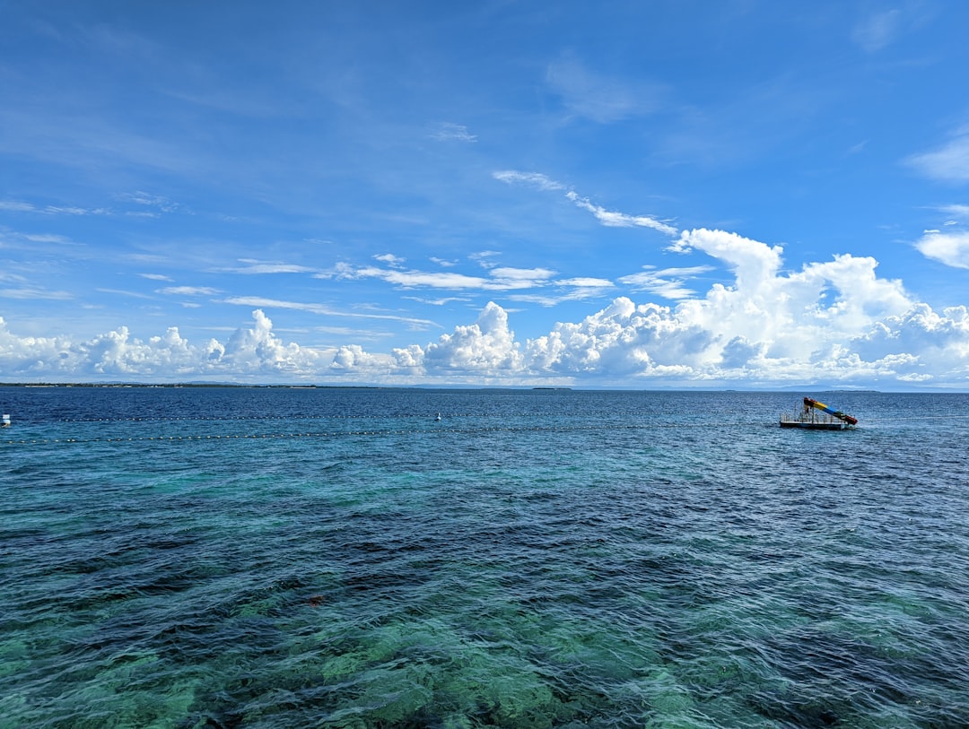 a boat floating on top of a large body of water, JPark<p></figure>Cebu