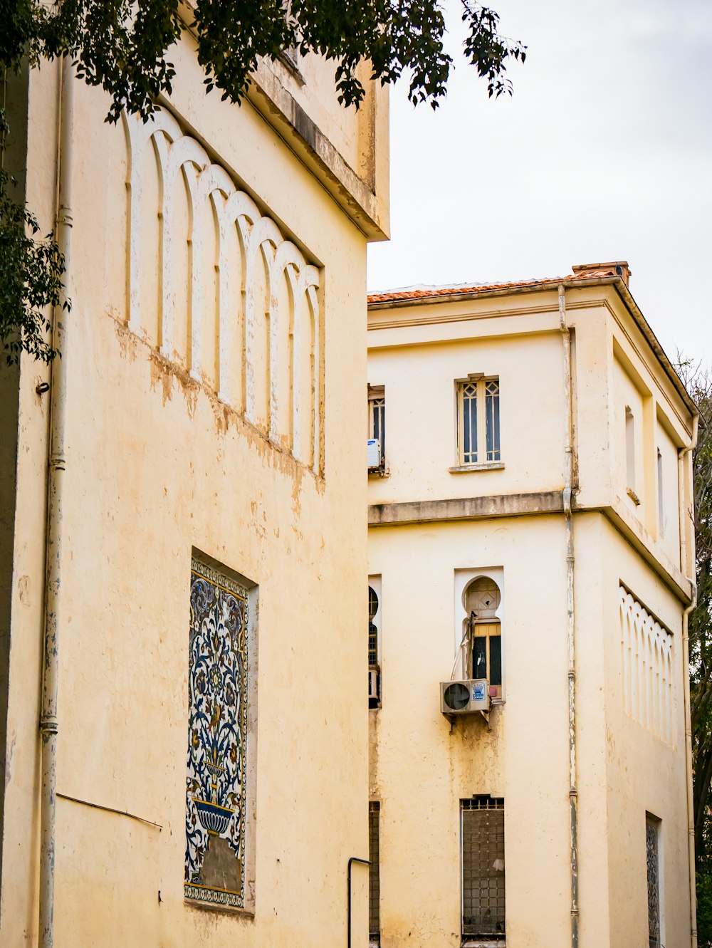 an old building with a clock on the side of it