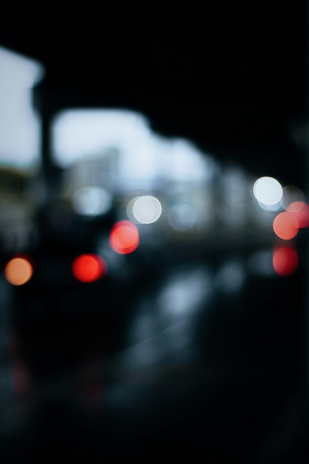 a blurry photo of a city street at night