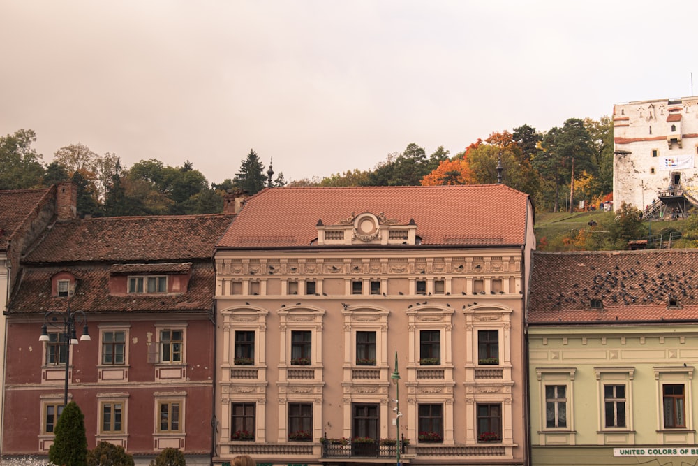 a row of buildings with a clock tower on top