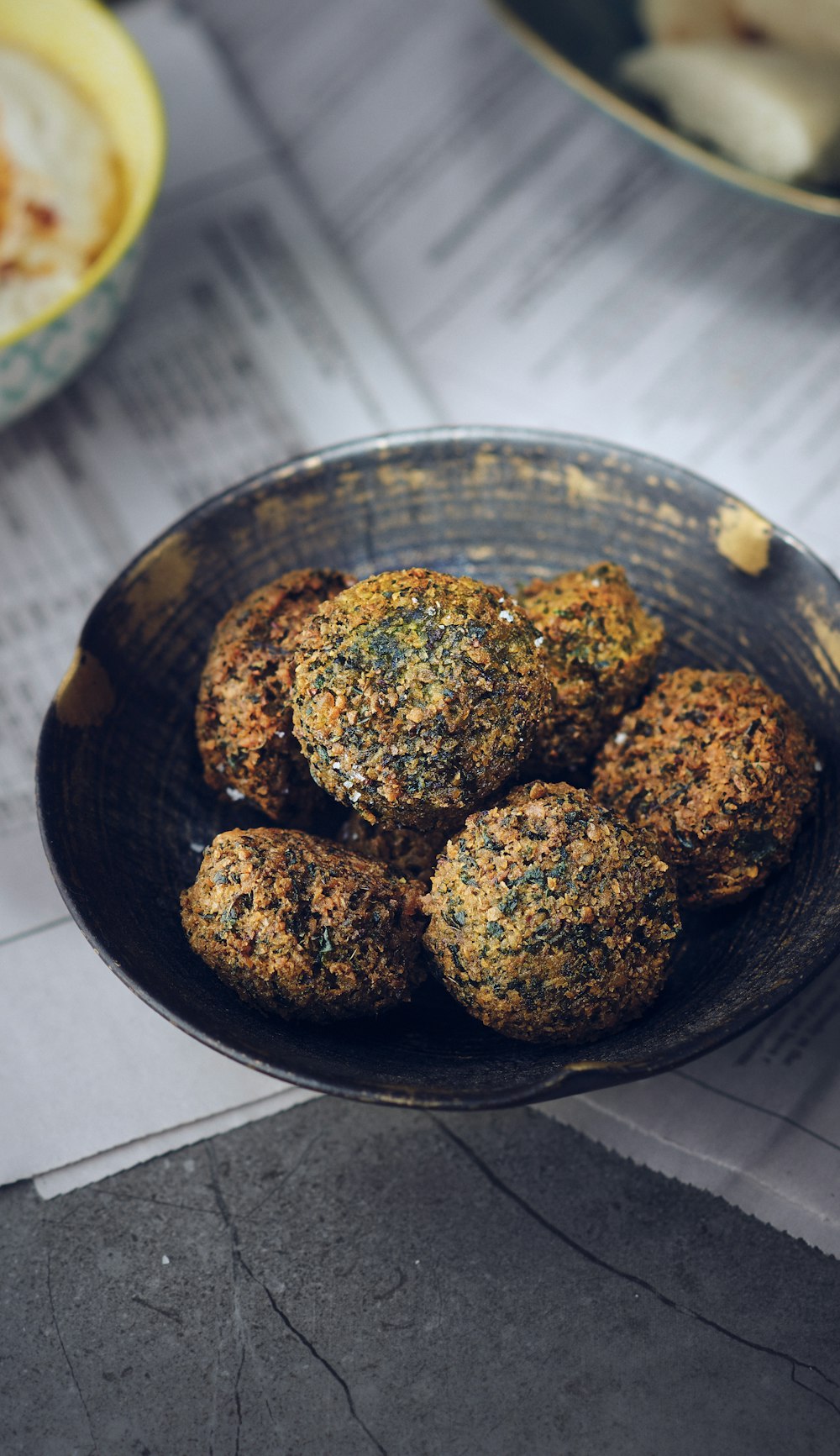 a bowl of food sitting on top of a table