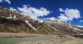 a mountain range with a river running through it