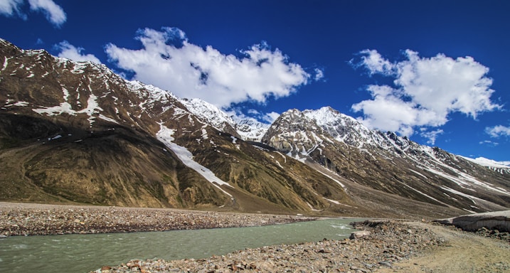 a mountain range with a river running through it