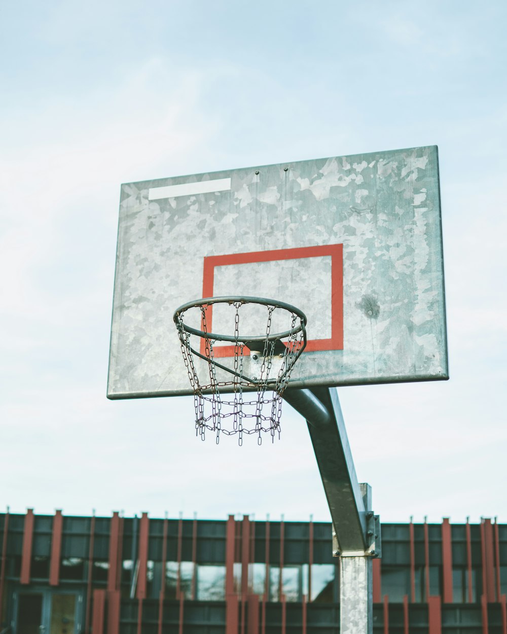 a basketball hoop in front of a building