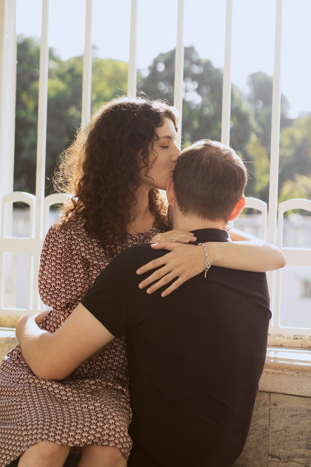 a couple of people that are kissing each other