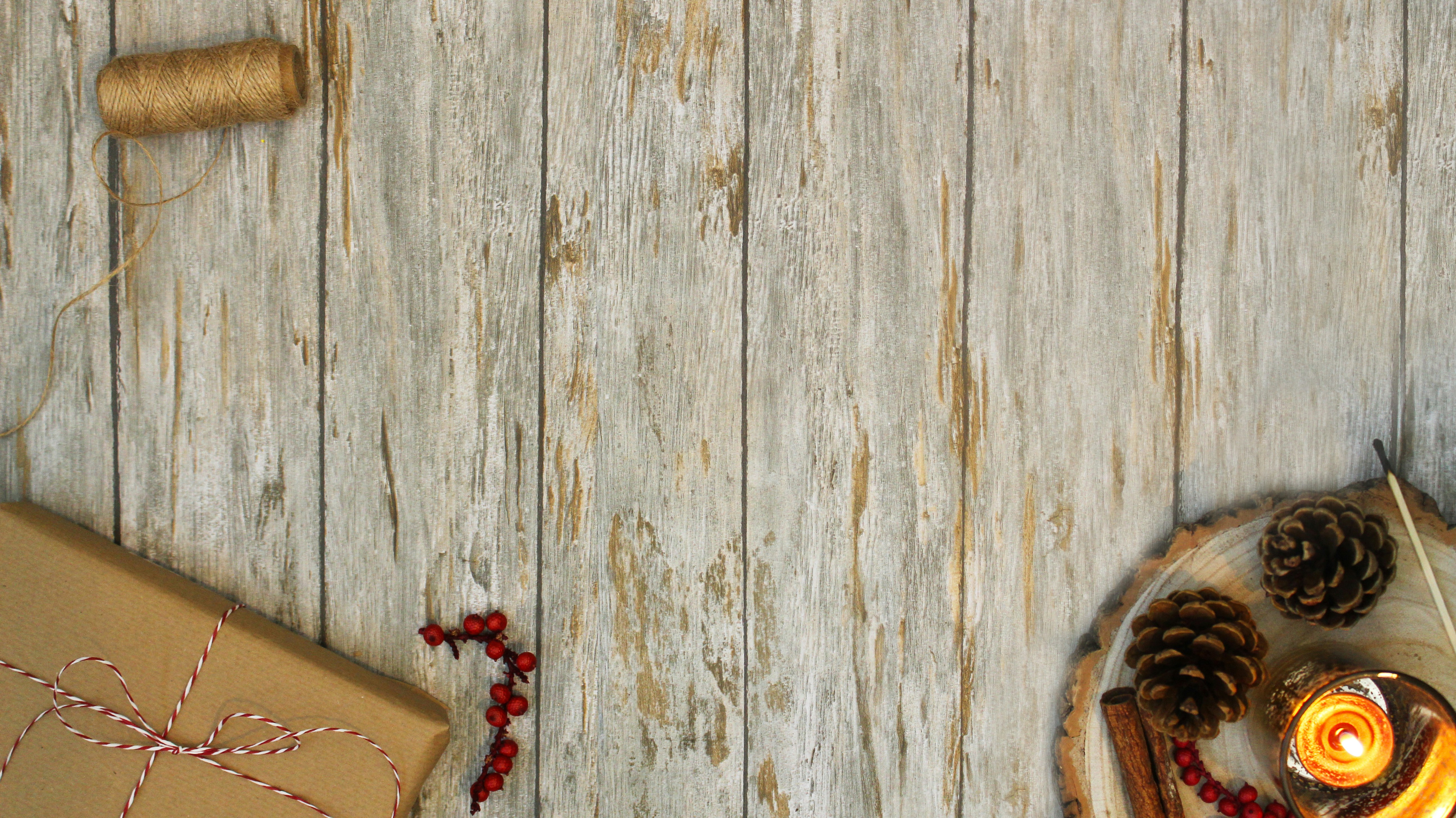 a table topped with a box and a candle