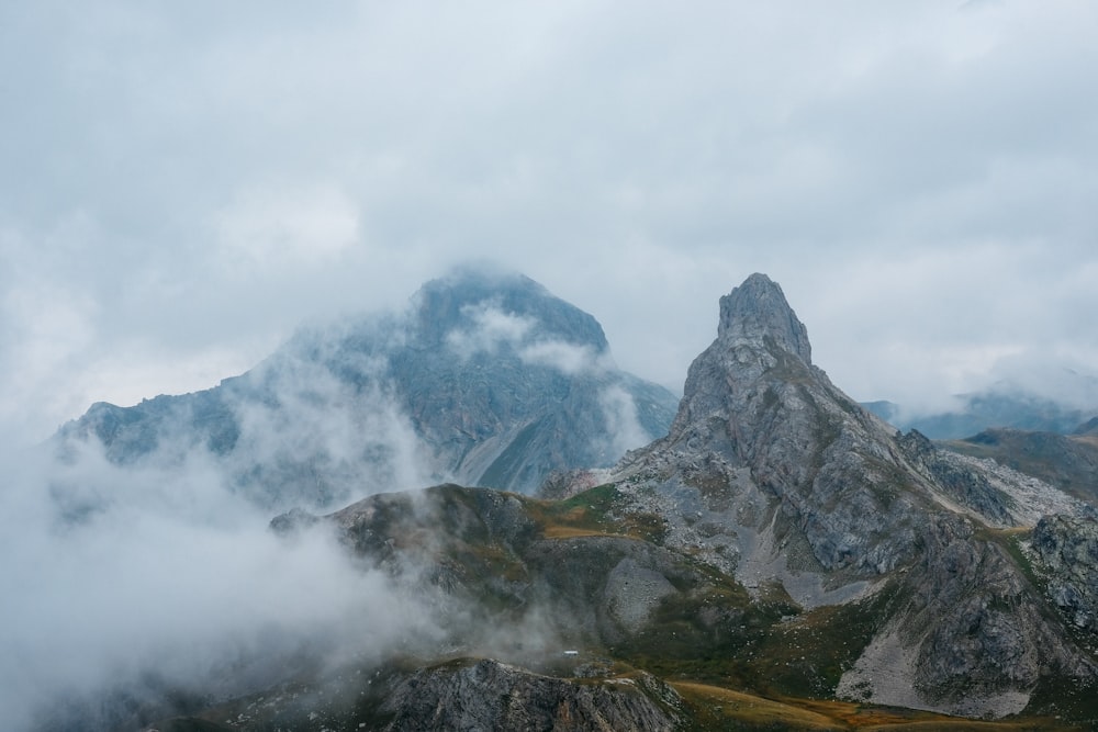 a mountain range covered in clouds and fog