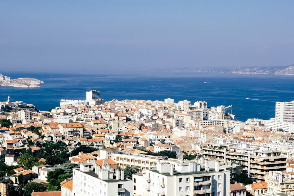 a view of a city with a body of water in the background