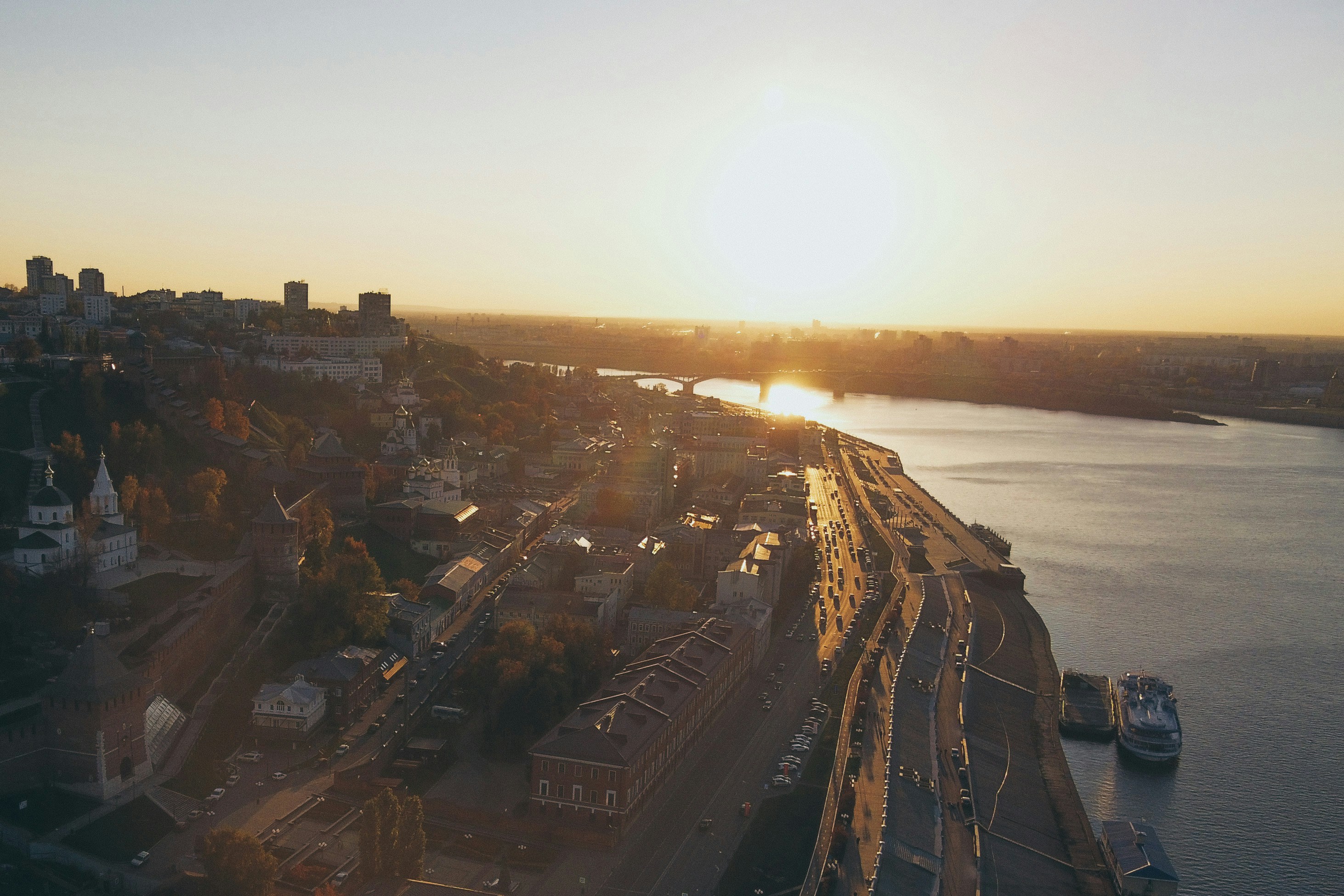 a large body of water with a city in the background, 