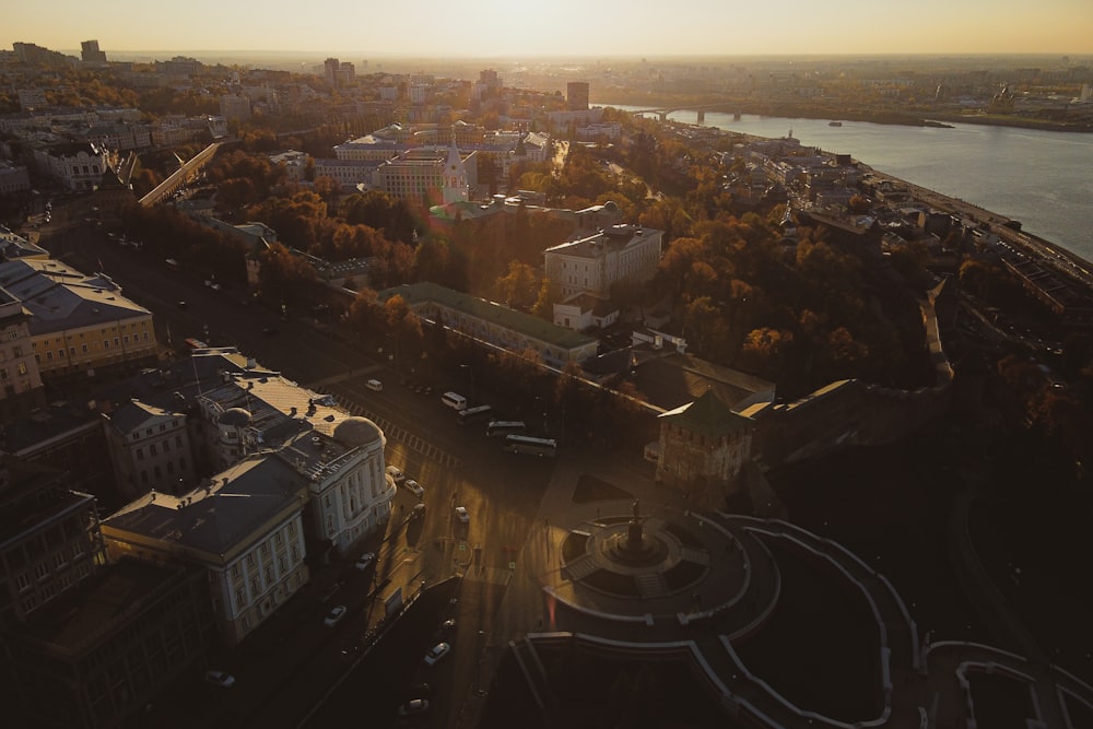 an aerial view of a city at sunset