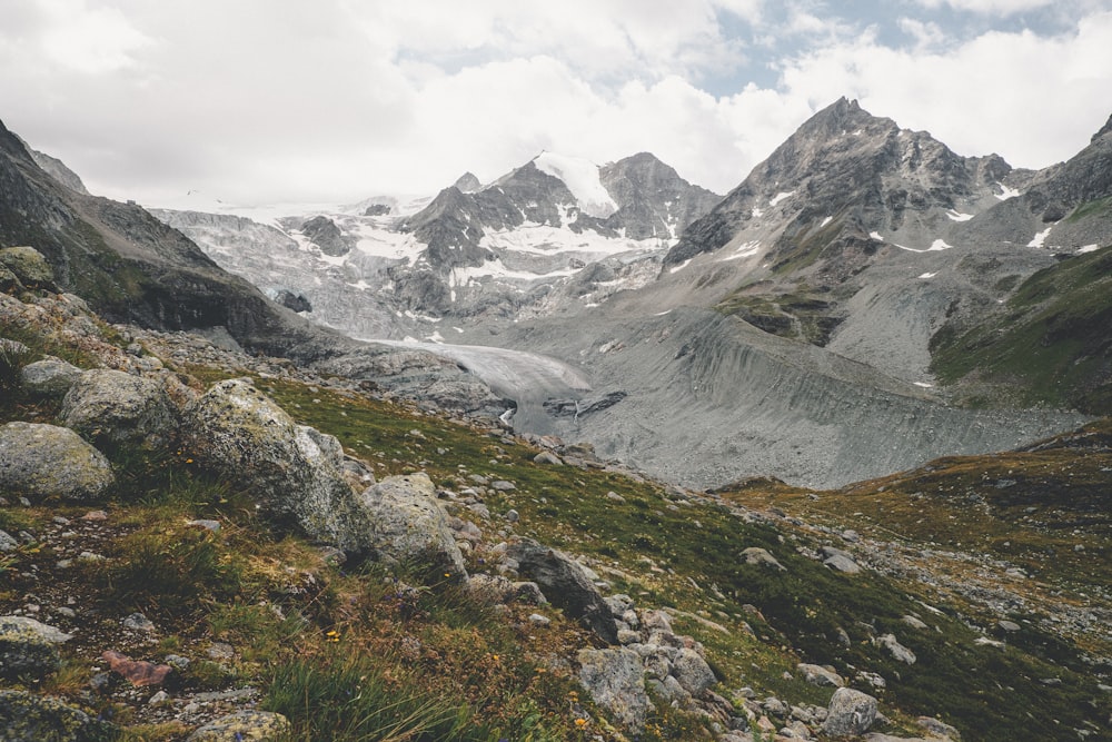 a view of a mountain range with snow on it