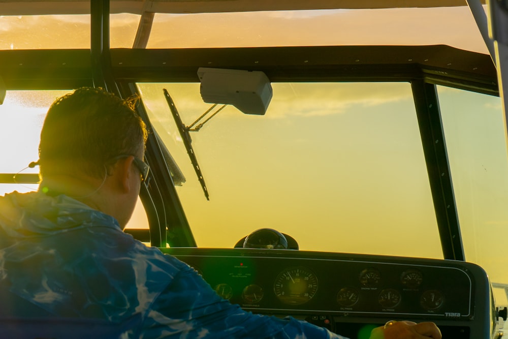 a man sitting in the cockpit of a helicopter