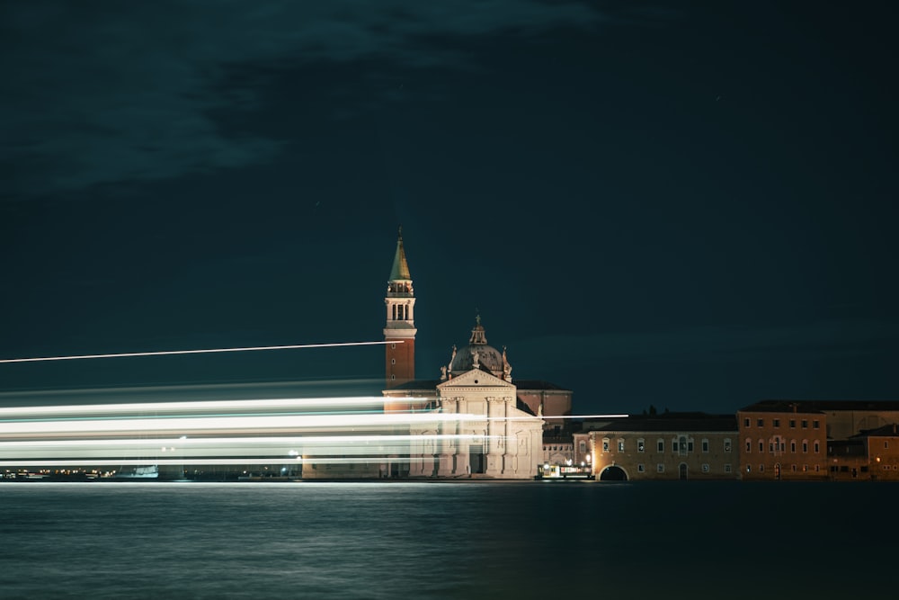 a long exposure photo of a building with a clock tower