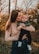 a woman holding a baby in her arms