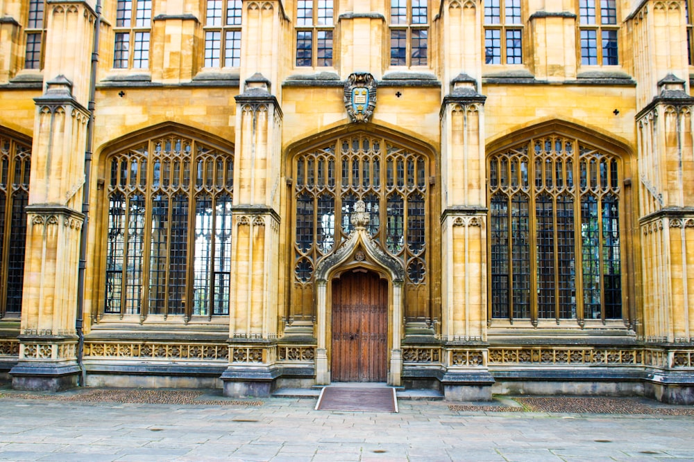 a large building with a wooden door in front of it