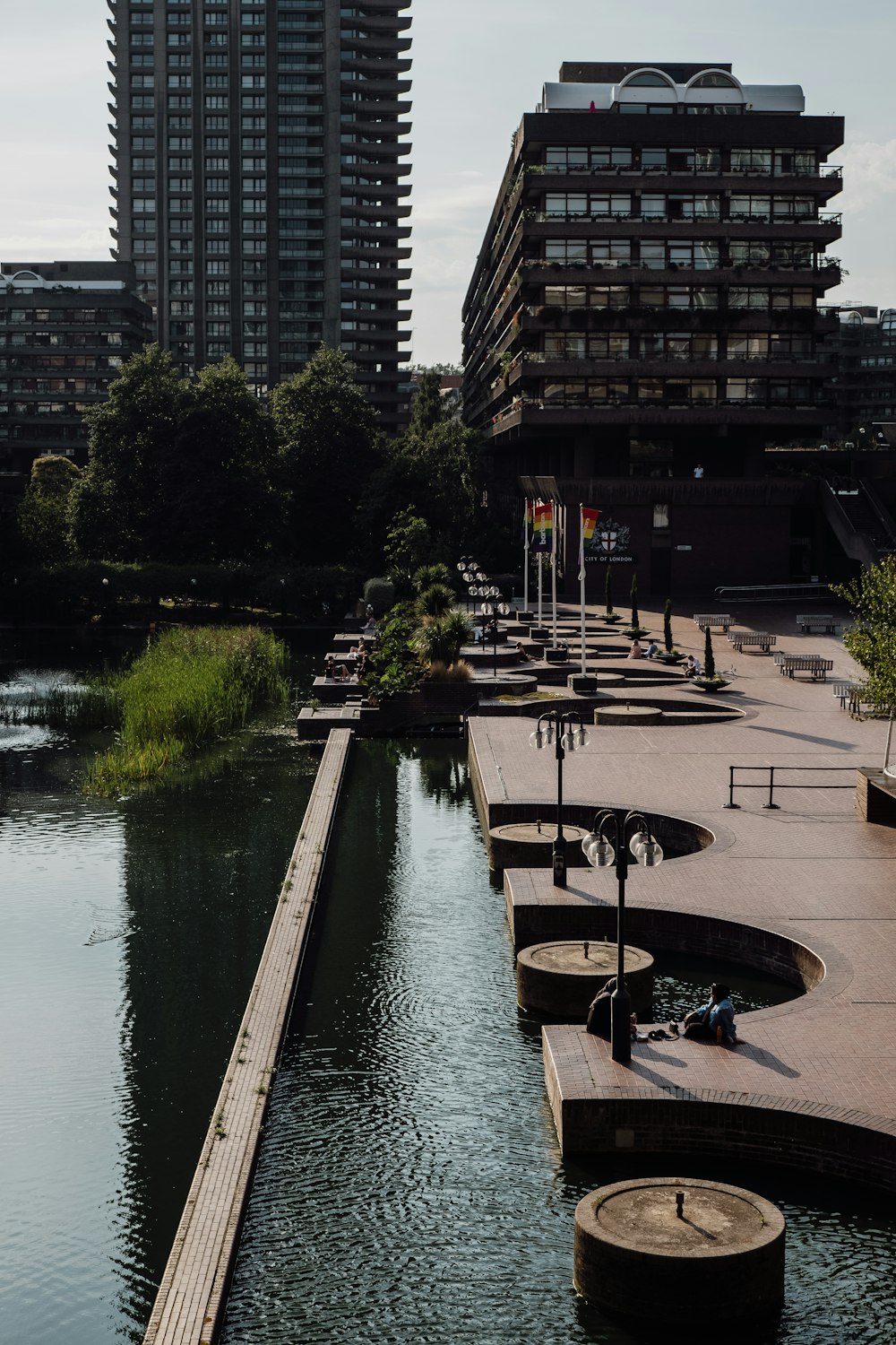 a body of water surrounded by tall buildings