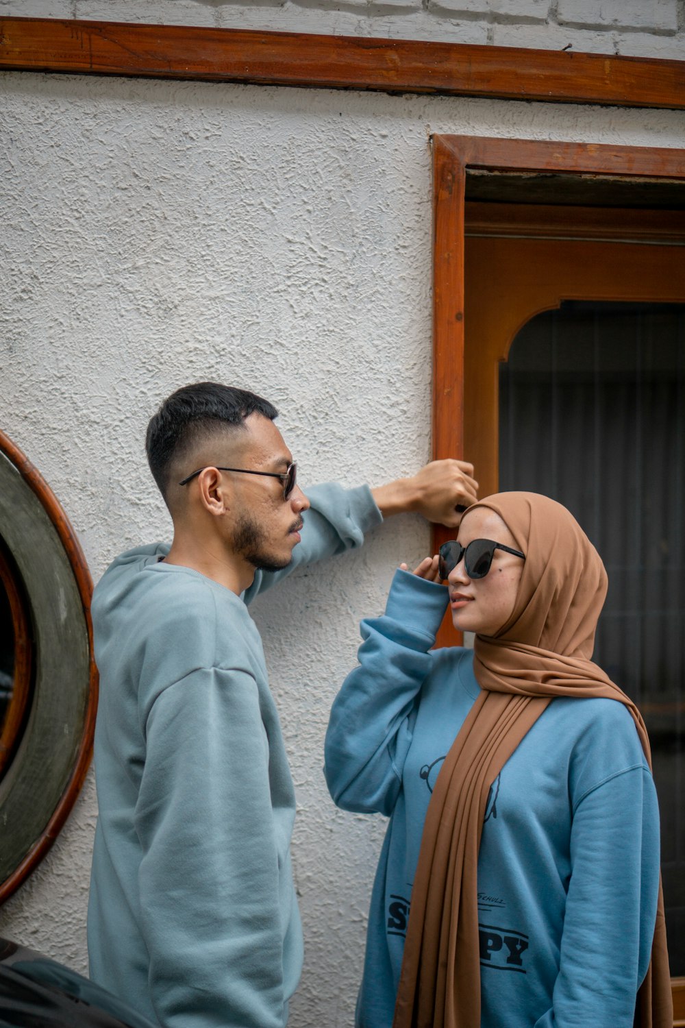 a man and a woman standing next to each other