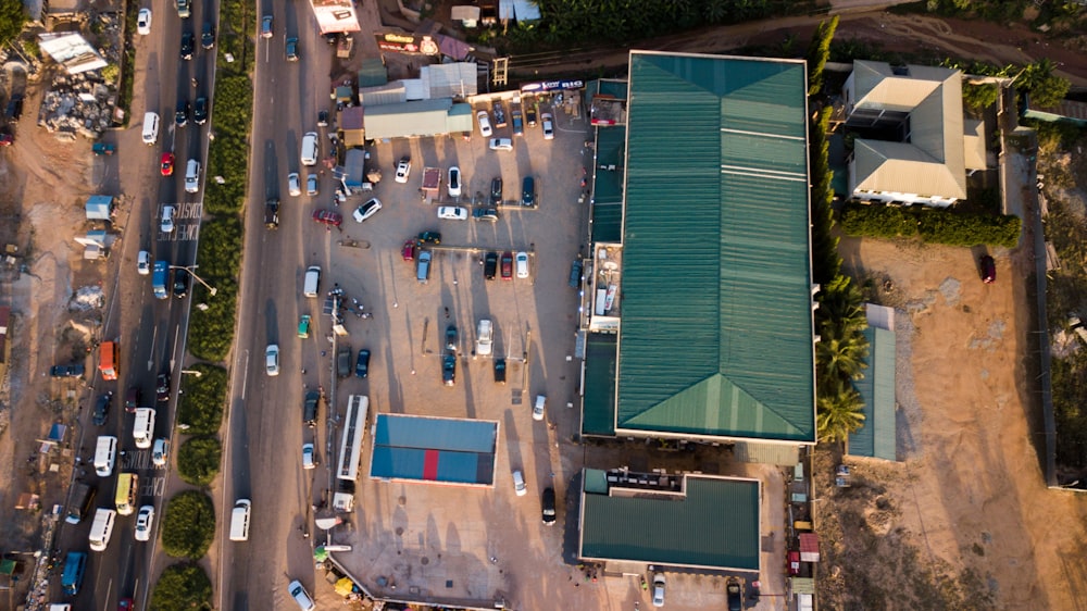 an aerial view of a parking lot with a green roof