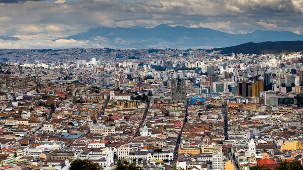 A view of a city with mountains in the background — Quito, Ecuador