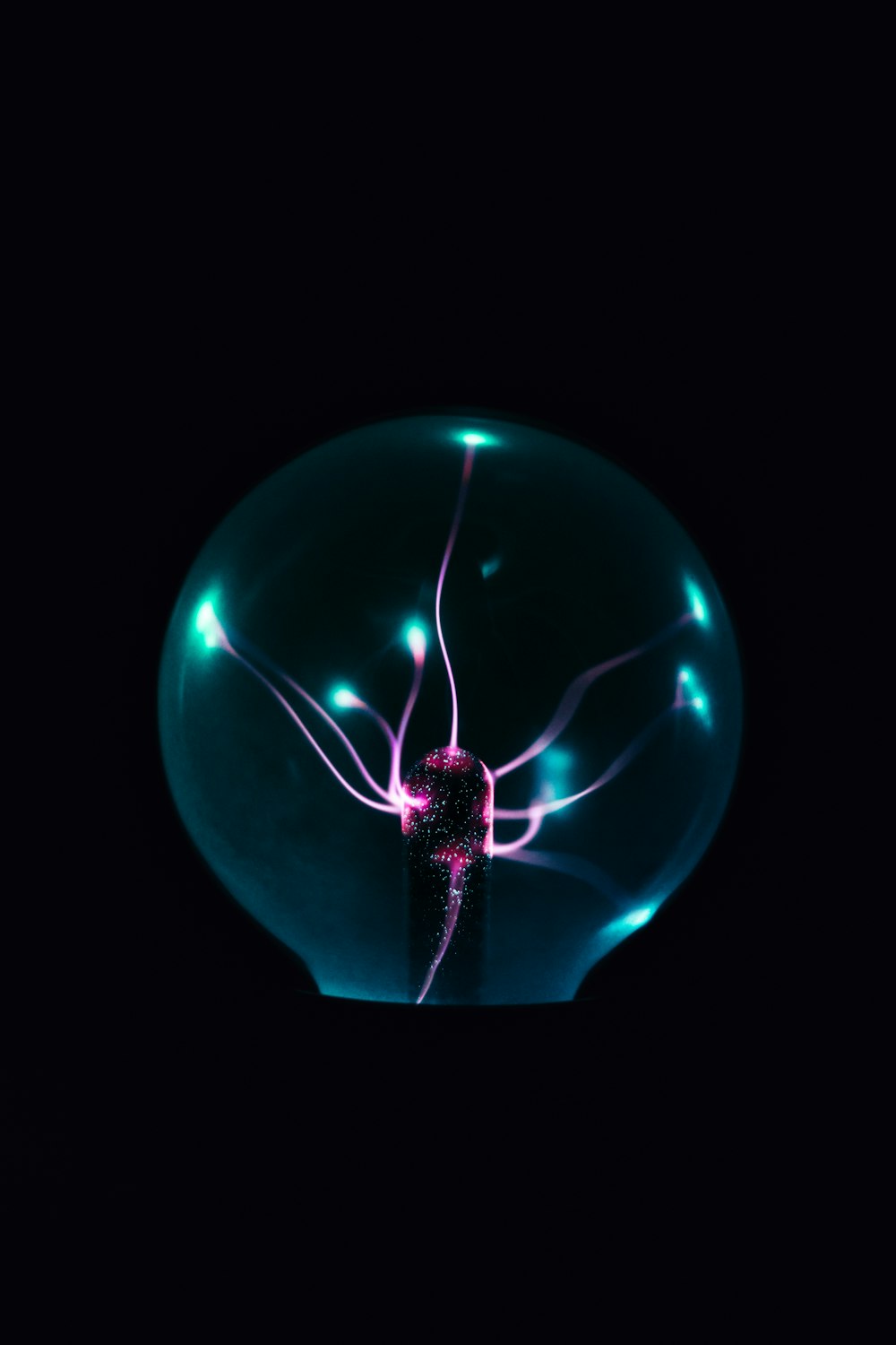 a blue light bulb with a black background