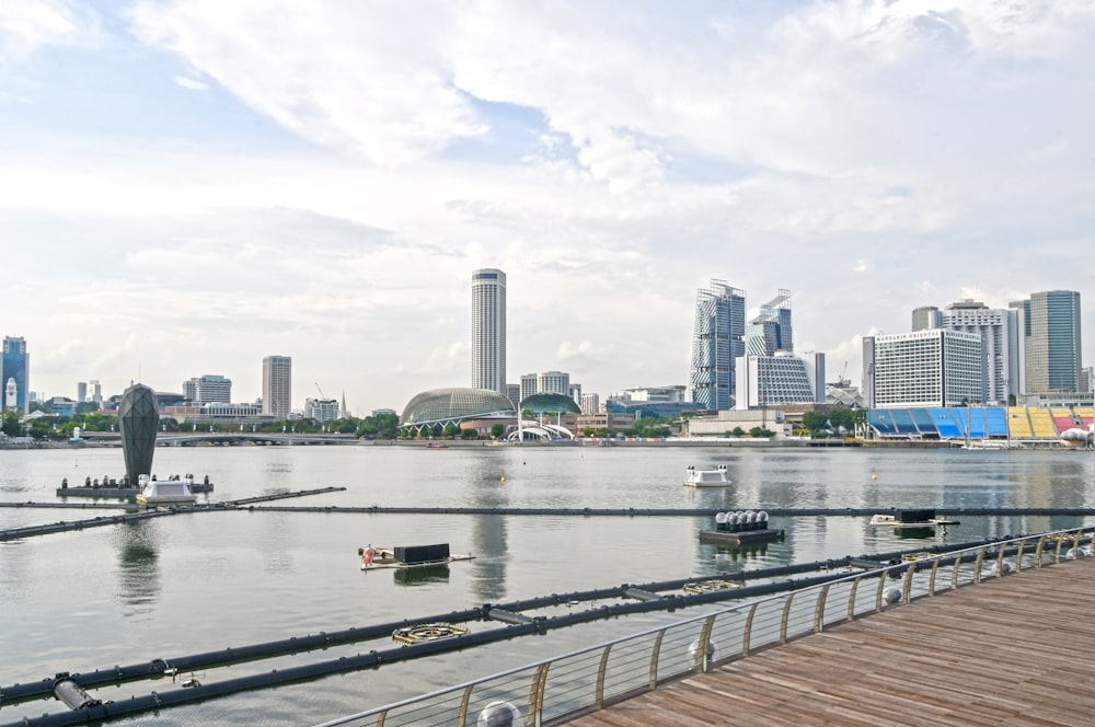 a body of water with a city in the background