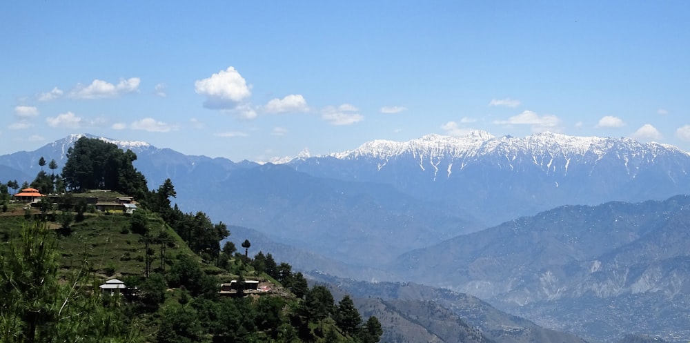 a view of a mountain range with houses on it