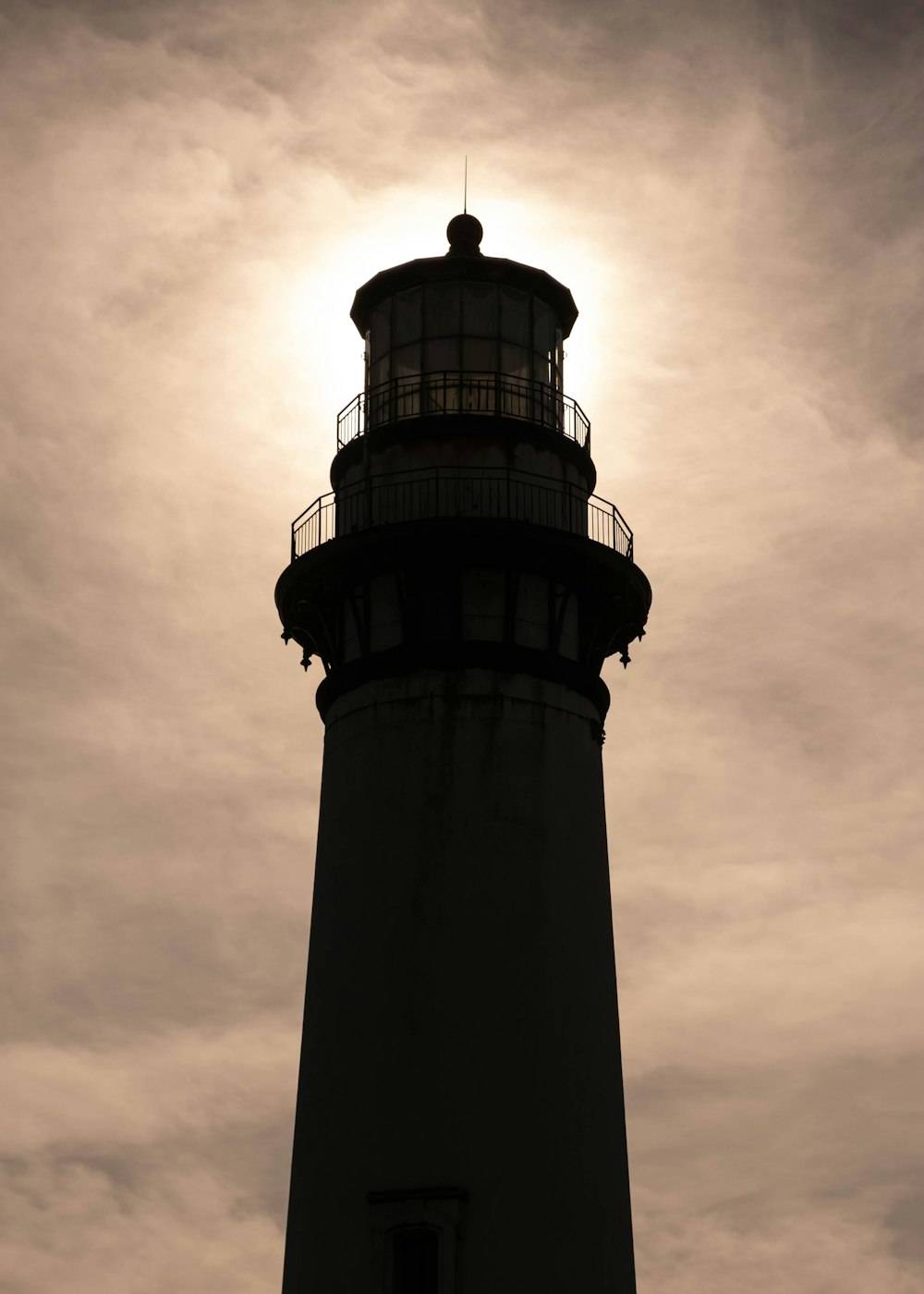 a black and white photo of a lighthouse