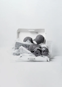 Close-up of a neatly packed 10x vastra studio box with branded wrapping and a thank you note.