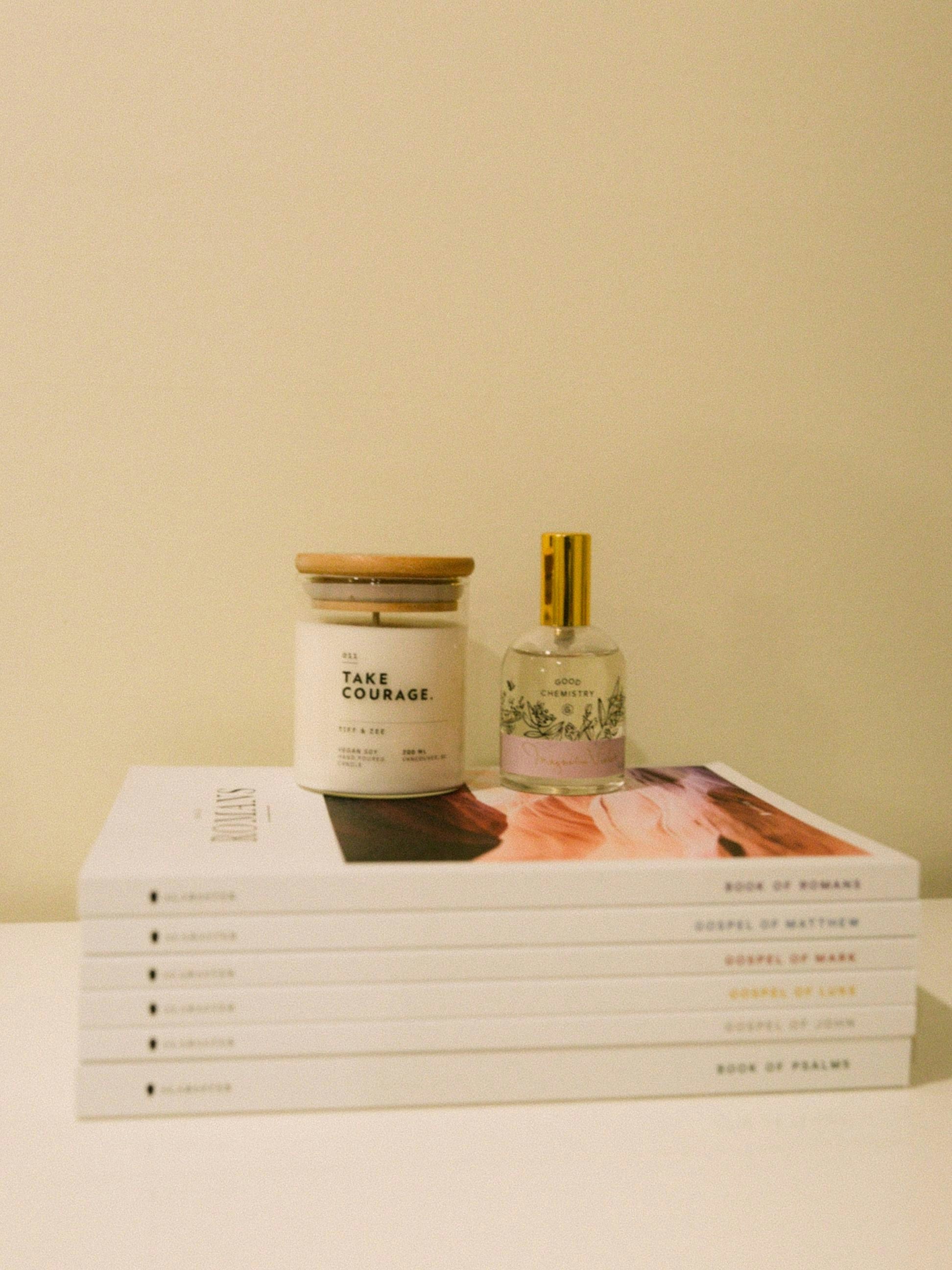 A stack of five books sitting on top of a table
