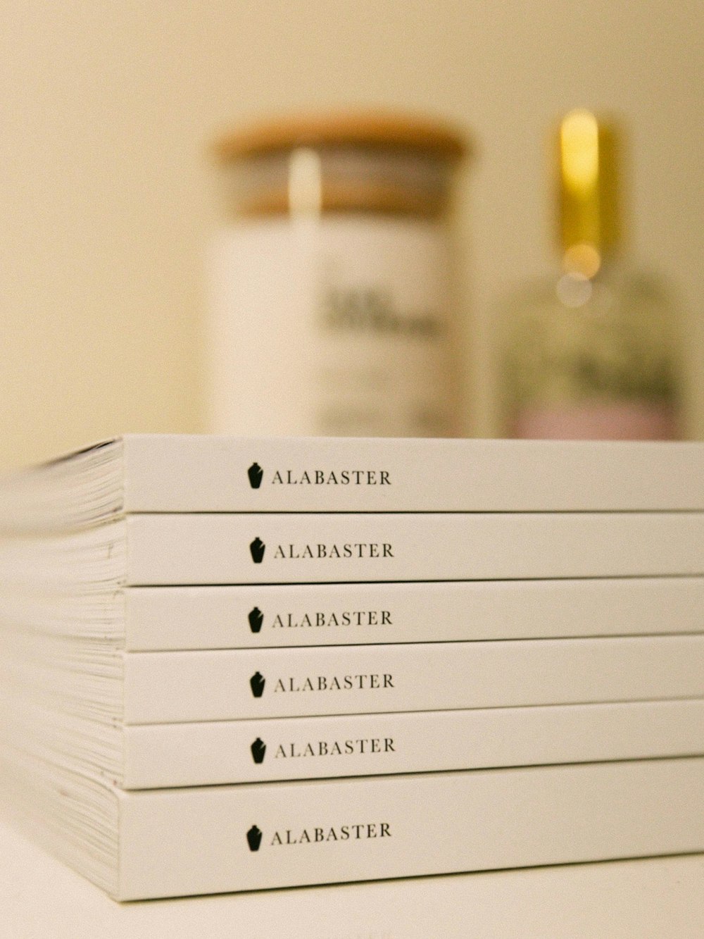 a stack of books sitting on top of a table