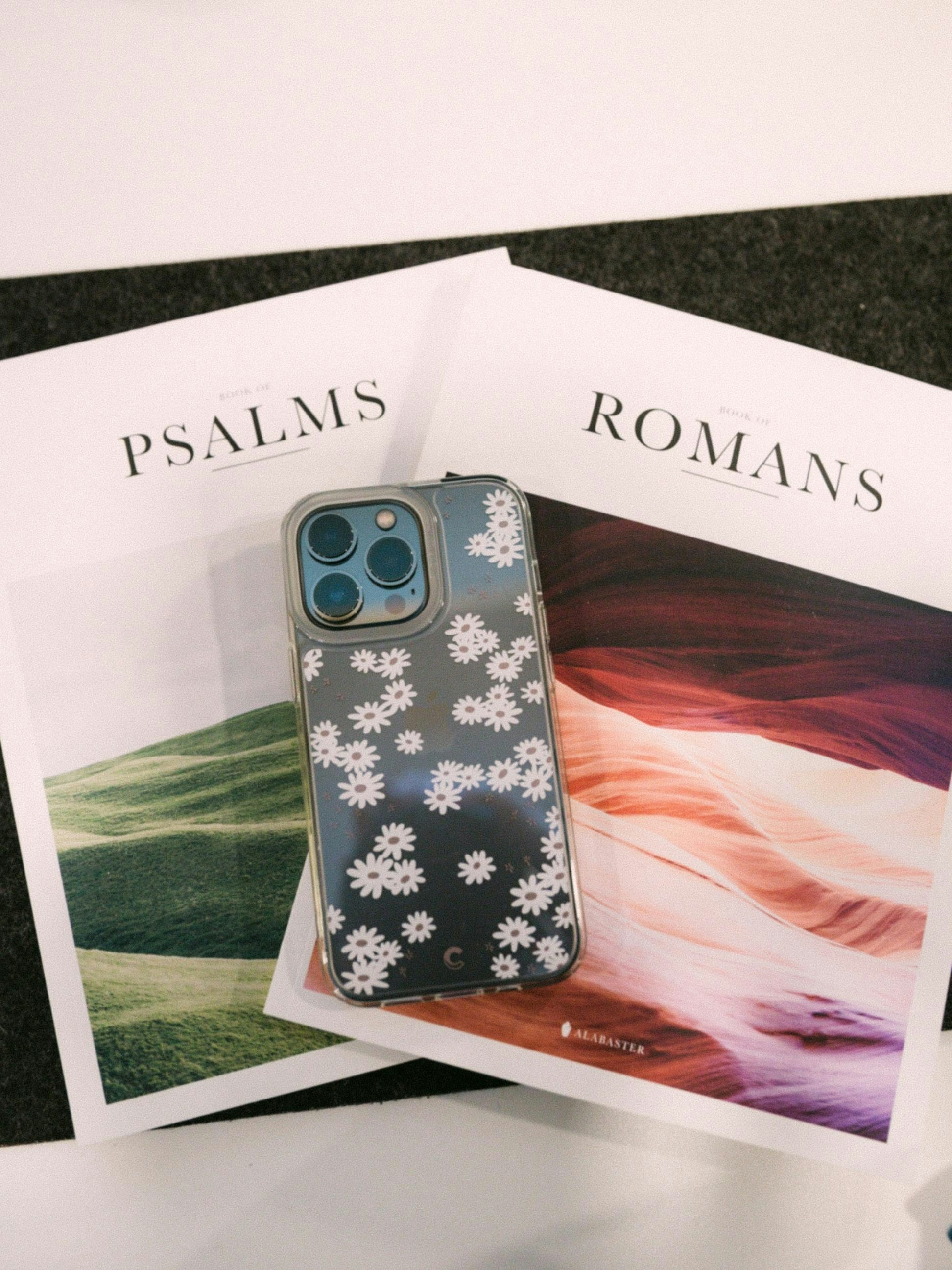 A phone case sitting on top of a magazine