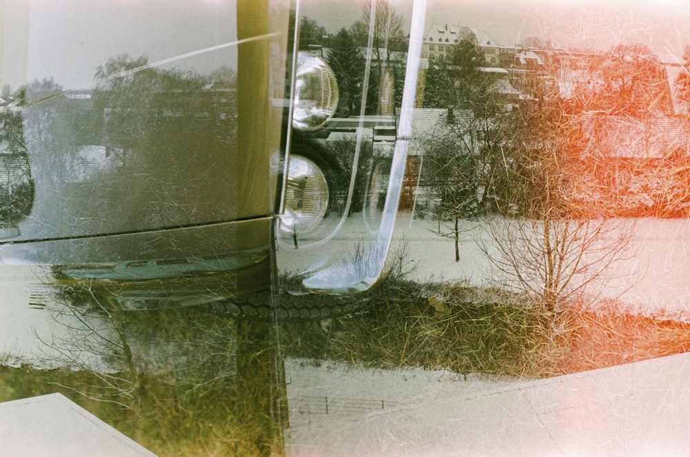 a reflection of a car in a mirror