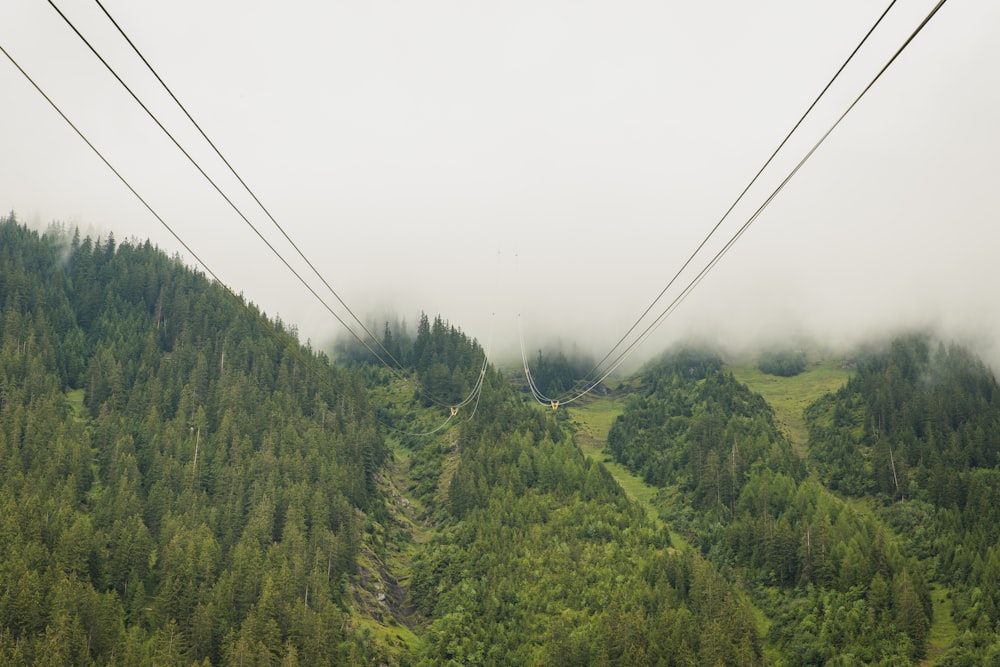 a view of a ski lift going up a hill