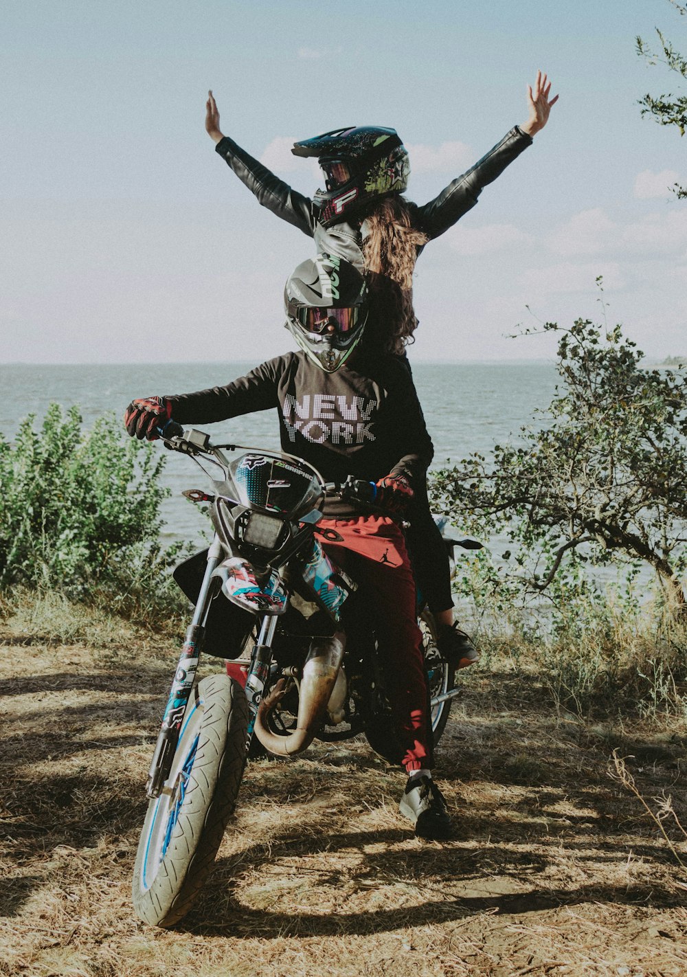 a man and a woman on a dirt bike