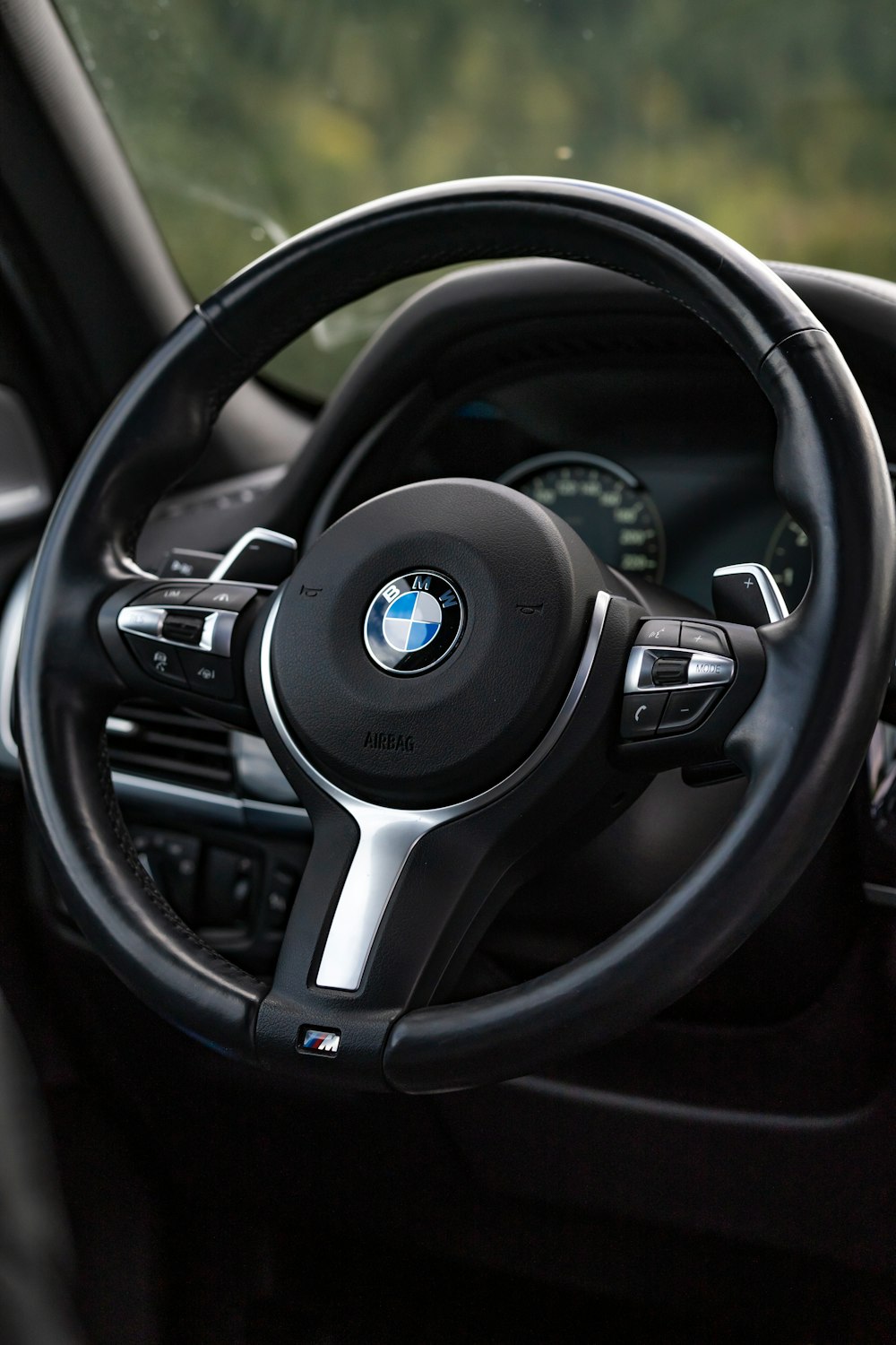 a steering wheel and dashboard of a car