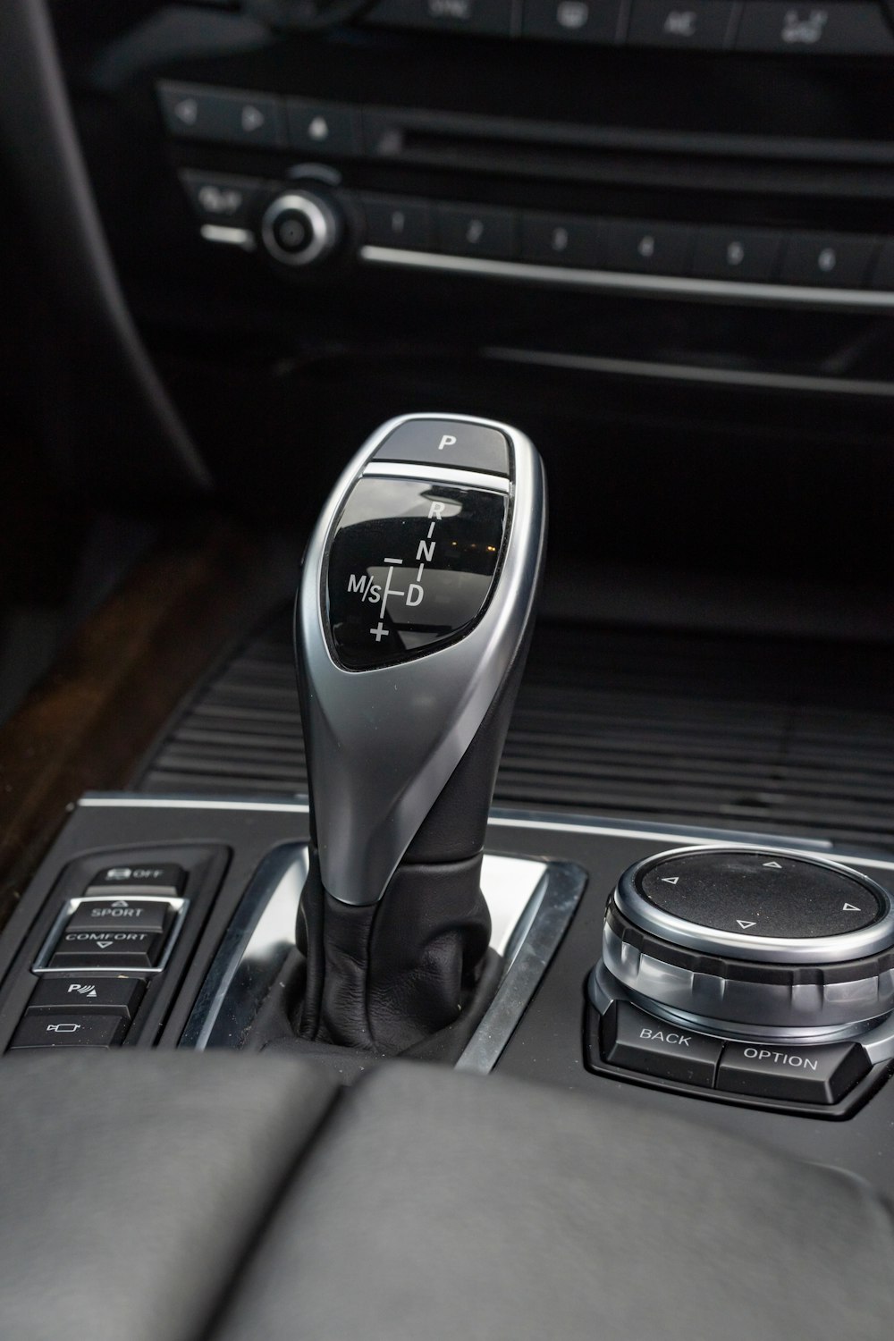 a car dashboard with a control panel and steering wheel