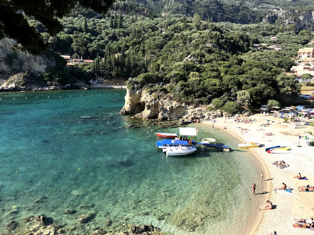 a boat is docked on the shore of a beach