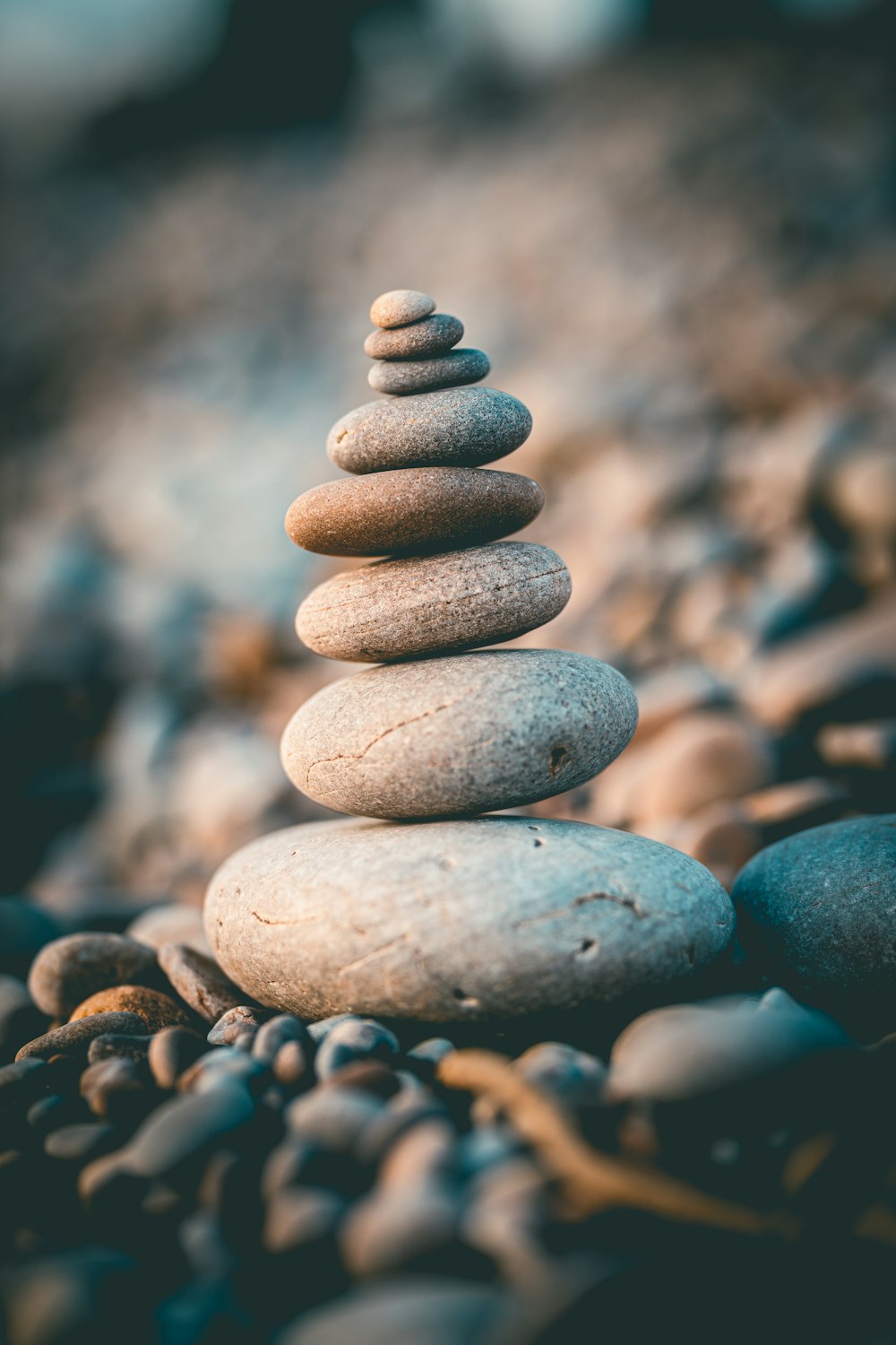 a stack of rocks sitting on top of a rocky beach