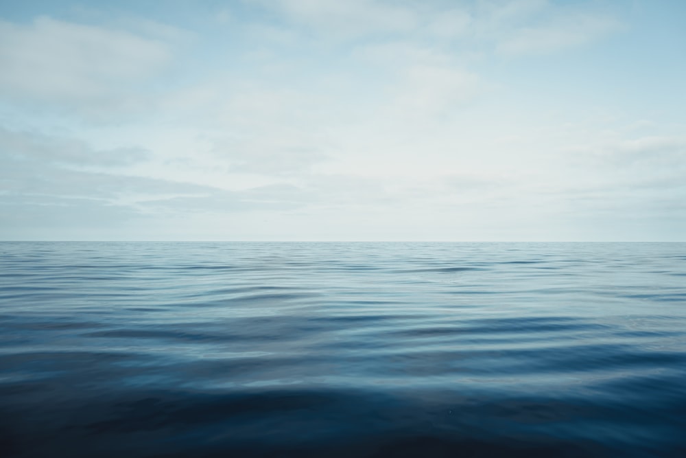 a large body of water with a sky background