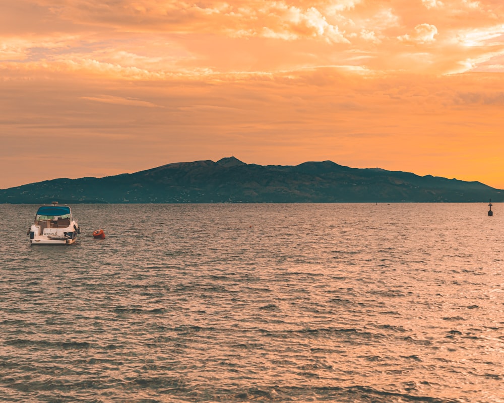 a boat floating on top of a large body of water