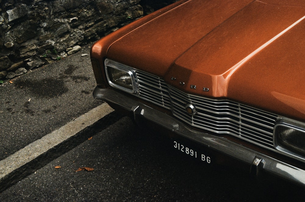 a brown car parked on the side of the road