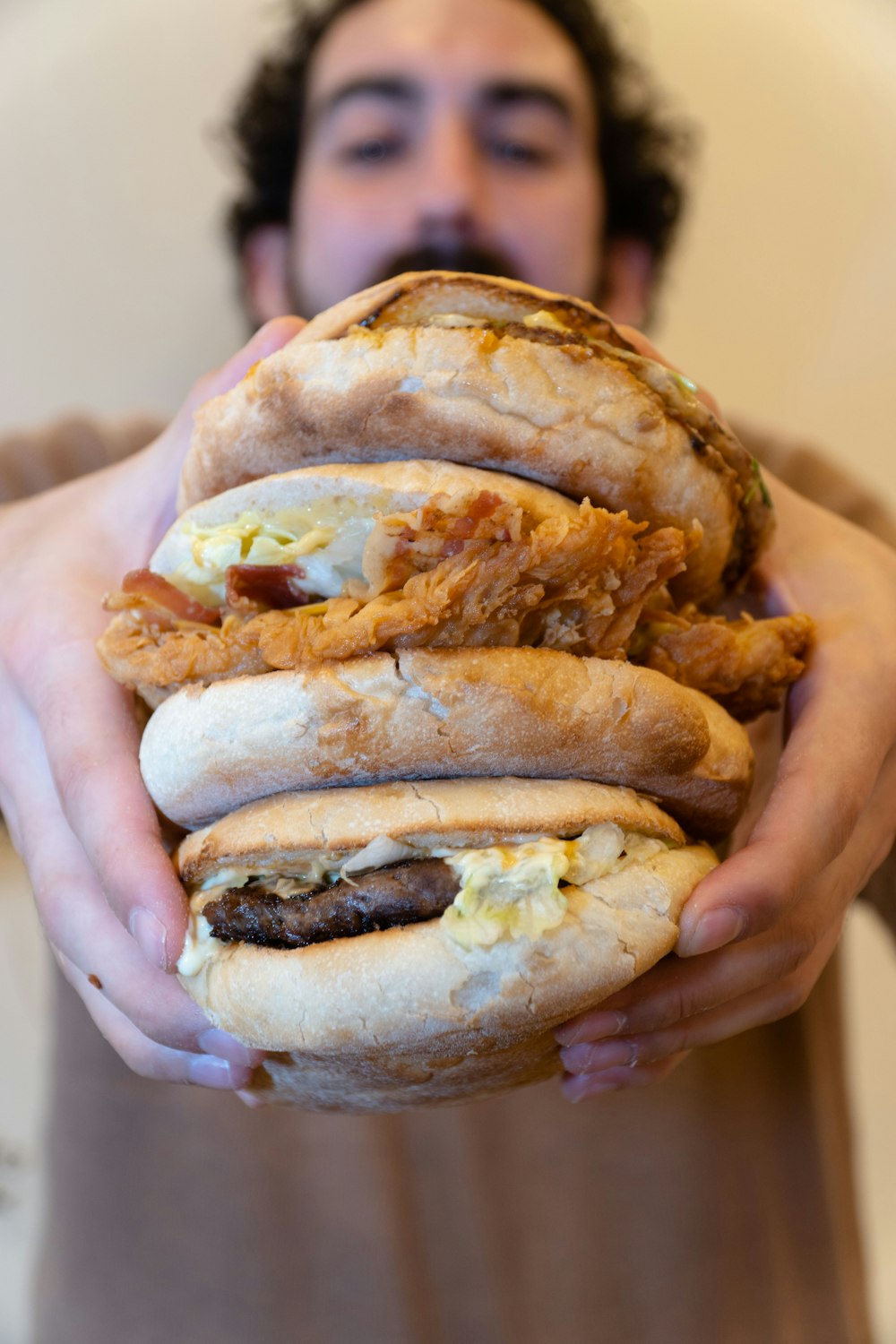 a man holding a large sandwich in his hands