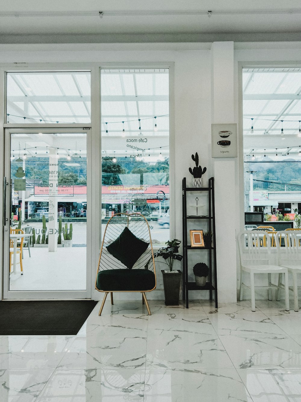 a room filled with furniture and a large window