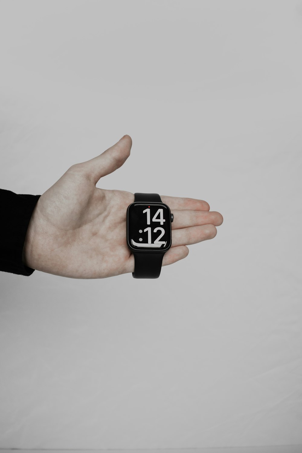 a person's hand with a wrist watch on it