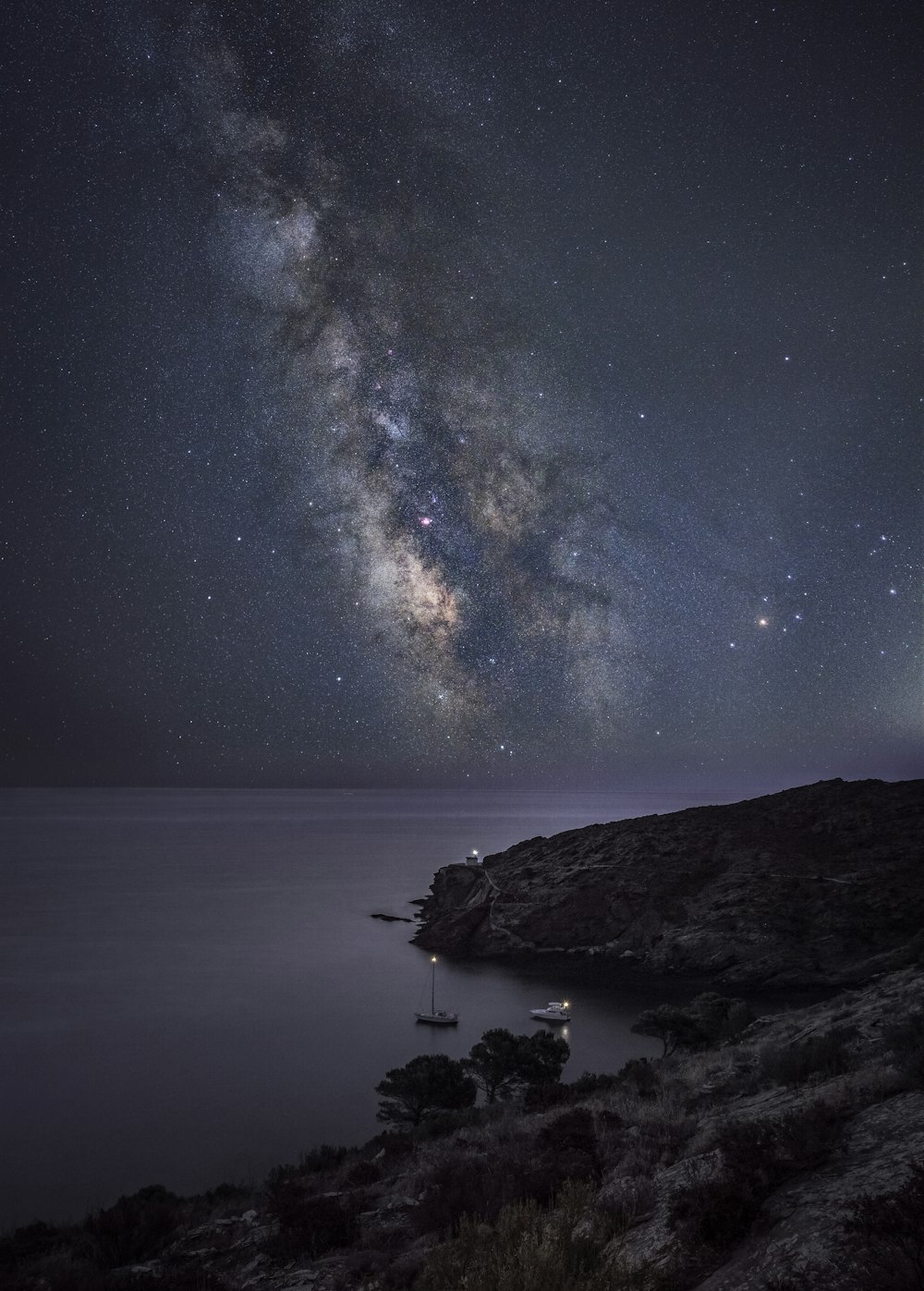 the night sky over a body of water