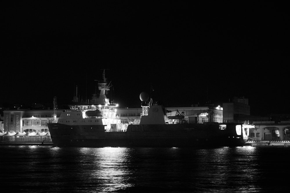 a large ship in a body of water at night